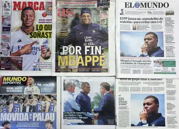 This picture taken on June 4, 2024 shows several Spanish newspapers' front pages a day after French forward Kylian Mbappe signed for Real Madrid