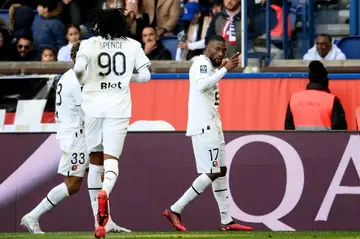 Karl Toko-Ekambi (R) celebrates putting Rennes in front against PSG