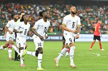 Jordan Ayew (R) celebrates after converting a penalty for Ghana against Mozambique.