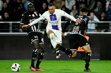 Kylian Mbappe (C) scored both goals for PSG in their 2-1 win at Ligue 1's bottom side Angers