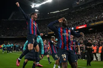 Franck Kessie salutes the Nou Camp as he leads Barcelona celebrations after hitting a late Clasico winner