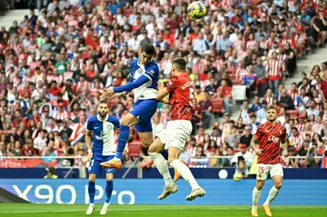 Atletico Madrid's Spanish forward Alvaro Morata (C) heads the ball home for his side's second against Mallorca