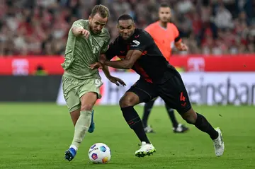 Bayern Munich forward Harry Kane (left) and Bayer Leverkusen defender Jonathan Tah vie for the ball during the side's 2-2 draw in September