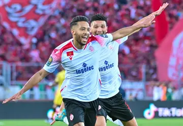 Zouhair el Moutaraji (L) celebrates after scoring for Wydad Casablanca of Morocco in the 2022 CAF Champions League final victory over Al Ahly of Egypt.