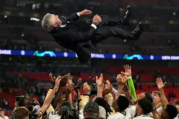 Real Madrid coach Carlo Ancelotti is thrown in the air by his players after they beat Borussia Dortmund to win the Champions League