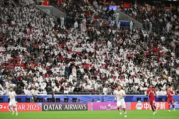 About 55,000 saw hosts Qatar seal their place in the last 16