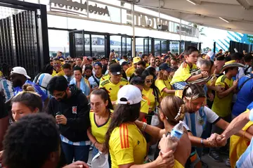 Fans of Colombia and Argentina try to enter the Hard Rock Stadium amid chaotic scenes ahead of the Copa America final