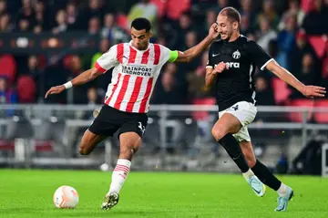 Cody Gakpo (L) has scored 13 goals for PSV Eindhoven this season