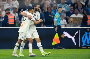 Alexis Sanchez celebrates with Sead Kolasinac after scoring Marseille's winner against Auxerre