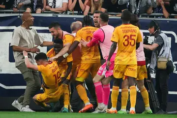Rodez player Lucas Buades was pushed over by a Bordeaux fan when celebrating his goal in the French Ligue 2 game, which was subsequently abandoned
