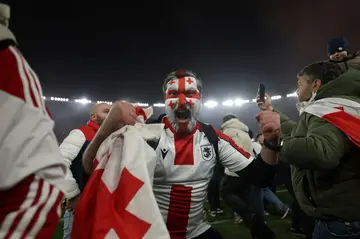 Georgia fans invaded the pitch in celebration after their team beat Greece on penalties to qualify for Euro 2024