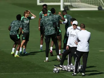 Real Madrid's Italian coach Carlo Ancelotti (2nd-R) in training ahead of the clash with Chelsea in the Champions League