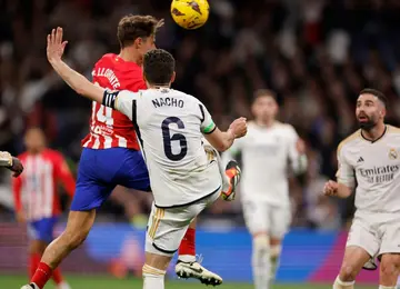 Marcos Llorente heads home the equaliser for Atletico Madrid in  the 1-1 draw with rivals and La Liga leaders Real Madrid