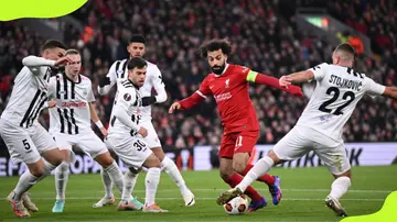 LASK defenders try to block Mohammed Salah