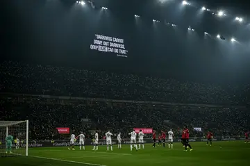 A quote by Martin Luther King is displayed on a San Siro screen in solidarity with Mike Maignan