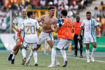 Baghdad Bounedjah, with his shirt removed in celebration, after scoring Algeria's second goal against Burkina Faso