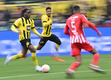 Dortmund forward Jamie Bynoe-Gittens (L) has scored three goals from 15 games this season