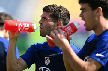 Christian Pulisic (L) aims to change negative perceptions of American soccer at the World Cup