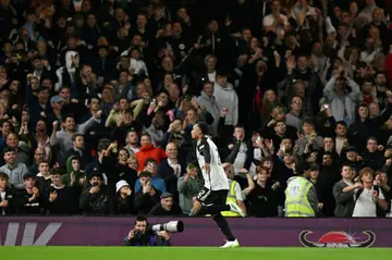 Fulham defender Kenny Tete celebrates after scoring the winning penalty against Tottenham