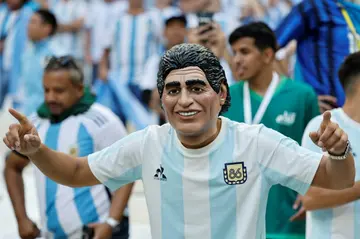 An Argentina fan wears a Diego Maradona mask at the World Cup in Qatar