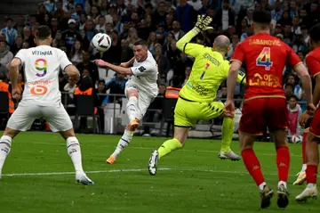 Jordan Veretout (centre) rounded off Marseille's win with a penalty