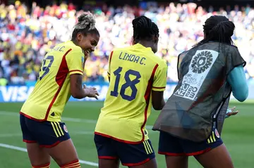 Colombia forward Linda Caicedo celebrates with her teammates after scoring