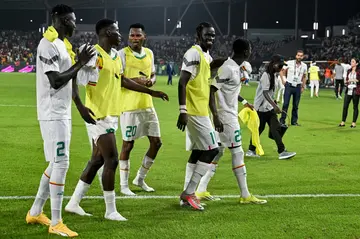 Senegal players celebrate after beating Guinea 2-0 in Yamoussoukro