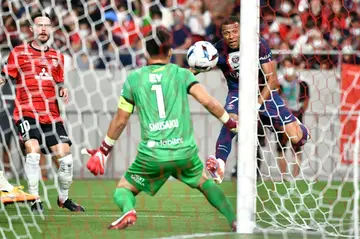 Paris Saint-Germain's Kylian Mbappe scores a goal past Urawa Reds'  goalkeeper Shusaku Nishikawa on Saturday