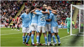 Erling Haaland celebrates scoring his side's first goal with teammates during the Premier League match between Sheffield United and Manchester City at Bramall Lane. Photo by Andrew Kearns.