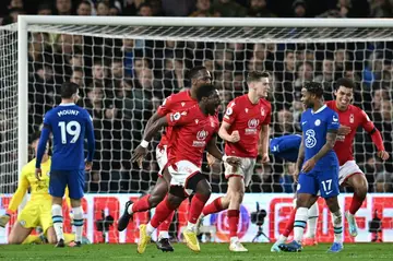 Nottingham Forest defender Serge Aurier (C) celebrates after scoring against Chelsea