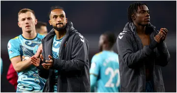 Theo Walcott and Romeo Lavia of Southampton after their Premier League match against Arsenal. Photo by Isabelle Field.