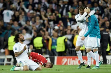 Real Madrid's Marcelo (L), Cristiano Ronaldo and Karim Benzema (R) celebrate after eliminating Bayern Munich in the 2018 Champions League semi-final