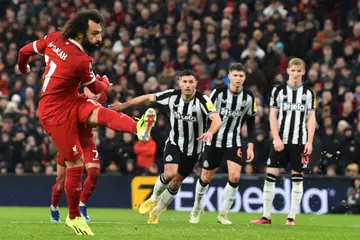 Mohamed Salah (left) scored twice after missing a first-half penalty in Liverpool's 4-2 win over Newcastle