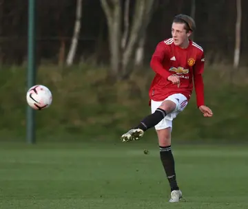 Robbie Savage's child Charlie, 17, signs his first professional contract with Manchester United