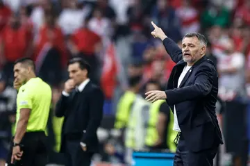 Willy Sagnol (R) shouts instructions to his players during Georgia's 3-1 defeat against Turkey in Euro 2024