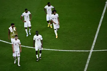 Qatar's players react at the end of their defeat to the Netherlands on Tuesday