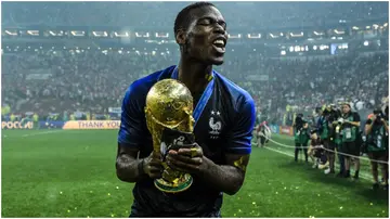Paul Pogba celebrates with the World Cup trophy following France's victory in the 2018 FIFA World Cup Russia Final at Luzhniki Stadium. Photo by David Ramos.