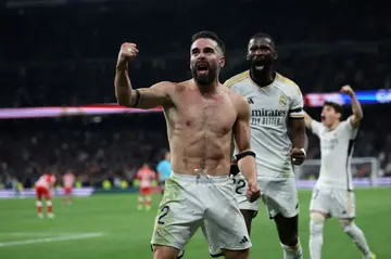 Real Madrid defender Dani Carvajal celebrates scoring his team's third goal to snatch victory in stoppage time against Almeria