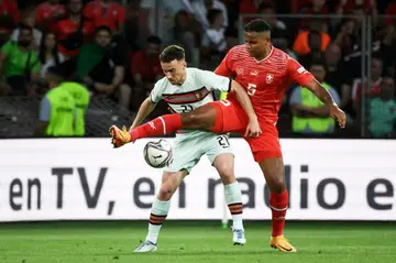 Manchester City's Swiss defender Manuel Akanji (R)