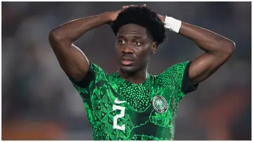 Ola Aina puts his hands on the head during the CAF Africa Cup of Nations knockout stage. Photo: Visionhaus.