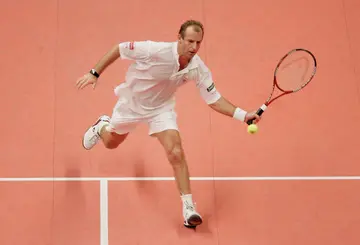 Thomas Muster of Austria in action against Pat Cash of Australia at The Masters Tennis tournament at the Royal Albert Hall on December 3, 2004 in London, England