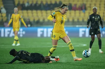 Sweden's midfielder Kosovare Asllani is tackled by South Africa defender Lebohang Ramalepe