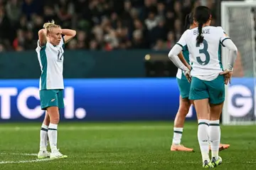 New Zealand players react after being knocked out of the Women's World Cup