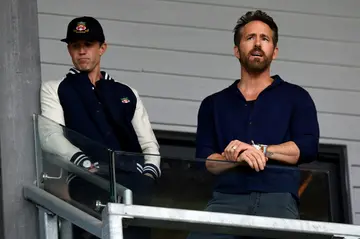 Star struck: Hollywood actors Rob McElhenney (left) and Ryan Reynolds (right) watch Wrexham promoted to the English Football League