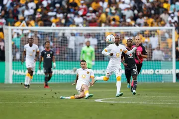 Yusuf Maart (C) scores with a shot from inside his half to give Kaizer Chiefs a 1-0 victory over Orlando Pirates in a South African Premiership match on October 29, 2022.