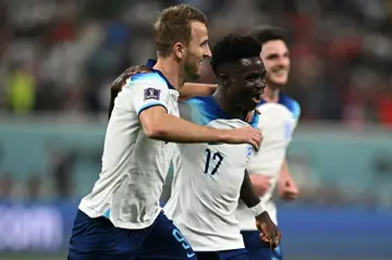England's Bukayo Saka celebrates with Harry Kane