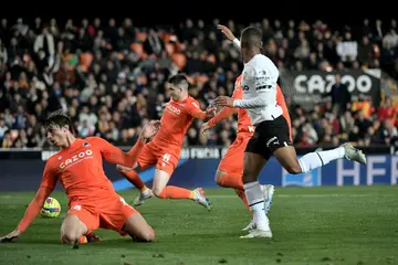 Real Sociedad's Igor Zubeldia (2L) scored an own goal that handed Valencia victory at Mestalla