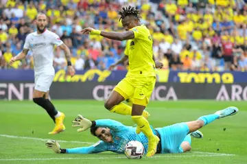 Sevilla goalkeeper Yassine Bounou foils Villarreal midfielder Samuel Chukwueze in a La Liga match