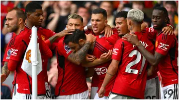 Bruno Fernandes celebrates with teammates after scoring the third goal during the Premier League match between Manchester United and Nottingham Forest. Photo by Stu Forster.