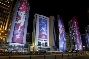 Banners bearing the images of the Asian Cup mascots displayed on buildings in the Qatari capital Doha